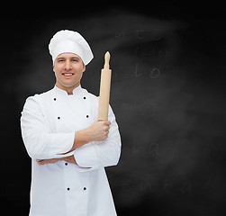 Image showing happy male chef cook holding rolling pin