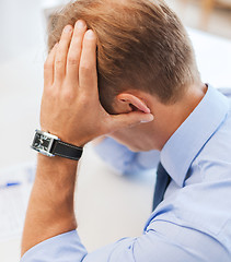 Image showing stressed businessman at work