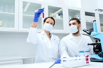 Image showing young scientists making test or research in lab