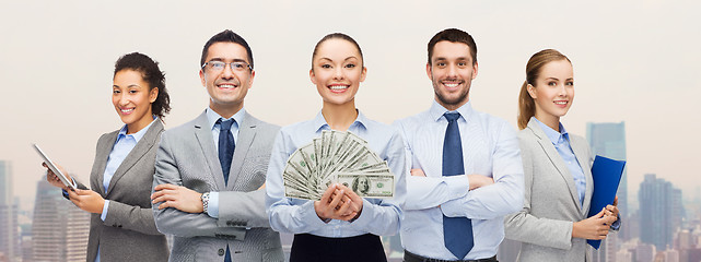 Image showing group of business people with dollar cash money