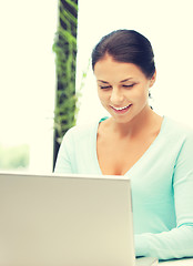 Image showing happy woman with laptop computer