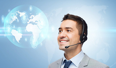 Image showing smiling businessman in headset