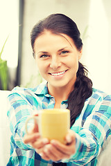 Image showing lovely housewife with mug