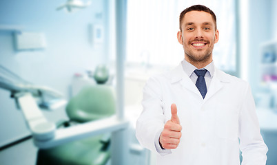 Image showing smiling male doctor showing thumbs up