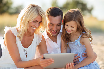 Image showing happy family with tablet pc taking picture