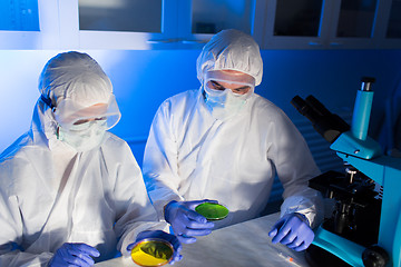 Image showing close up of scientists with test samples in lab