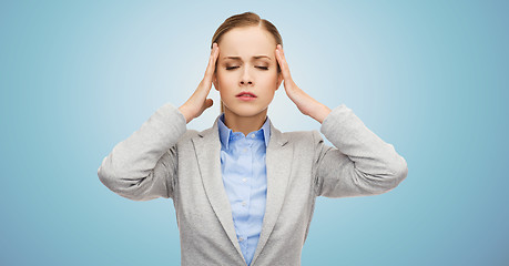 Image showing stressed businesswoman having headache