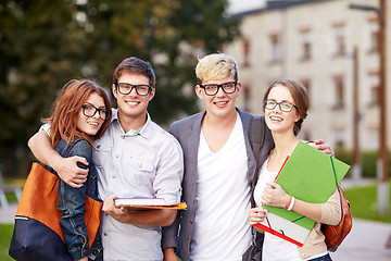 Image showing happy teenage students with school folders