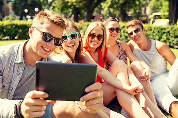 Image showing smiling friends with tablet pc making selfie