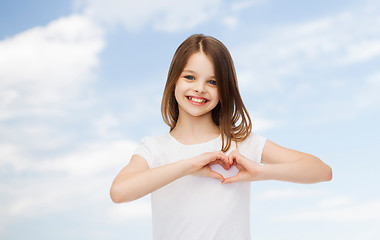 Image showing smiling little girl in white blank t-shirt