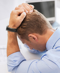 Image showing stressed businessman at work