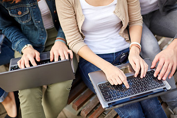 Image showing close up of students or teenagers with laptop