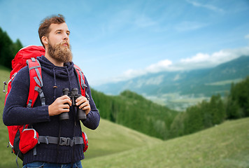 Image showing man with backpack and binocular outdoors