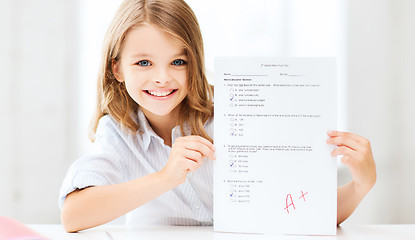 Image showing girl with test and A grade at school