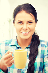 Image showing lovely housewife with mug