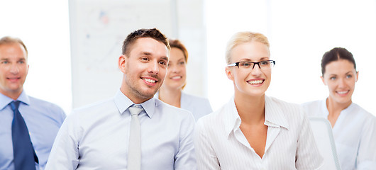 Image showing businessmen and businesswomen on conference