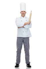 Image showing happy male chef cook holding rolling pin