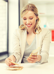 Image showing businesswoman with euro cash money