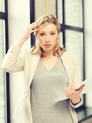 Image showing worried woman with documents