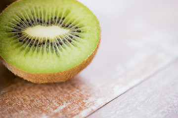 Image showing close up of ripe kiwi slice on table