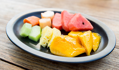 Image showing plate of fresh juicy fruits at asian restaurant