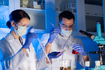 Image showing close up of scientists making test in lab