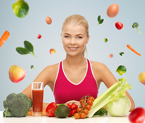 Image showing happy woman with vegetarian food and vitamins