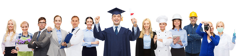 Image showing happy bachelor with diploma over professionals