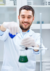 Image showing young scientist making test or research in lab