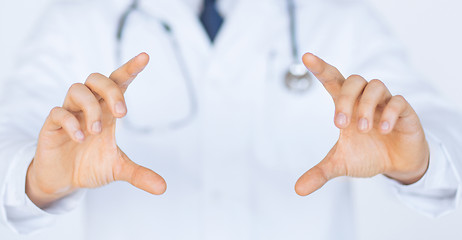 Image showing doctor with holding something with hands
