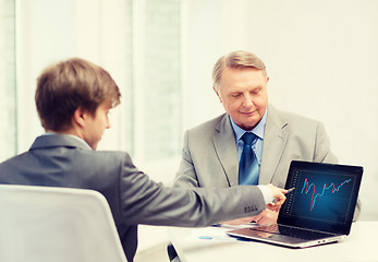 Image showing older man and young man with laptop computer