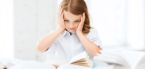 Image showing pretty girl with many books at school