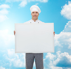 Image showing happy male chef cook holding white blank big board