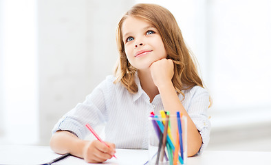 Image showing little student girl drawing at school