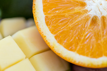 Image showing close up of fresh juicy orange and mango slices