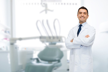 Image showing smiling male middle aged dentist