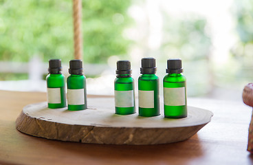 Image showing close up of aromatic oil bottles set at hotel room