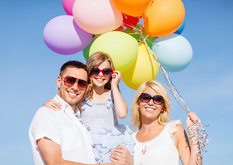 Image showing family with colorful balloons