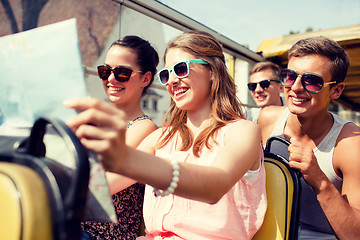 Image showing group of smiling friends traveling by tour bus