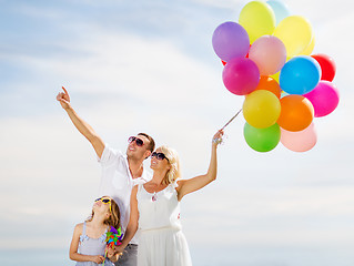 Image showing family with colorful balloons