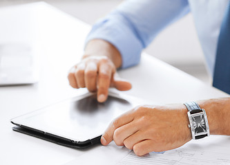 Image showing businessman with tablet pc in office