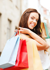 Image showing woman with shopping bags in ctiy