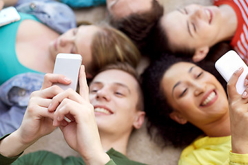 Image showing close up of students or friends with smartphones