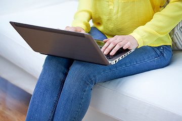 Image showing close up of woman with laptop computer at home