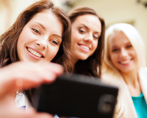 Image showing beautiful girls taking selfie in the city