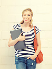 Image showing happy and smiling teenage girl with laptop