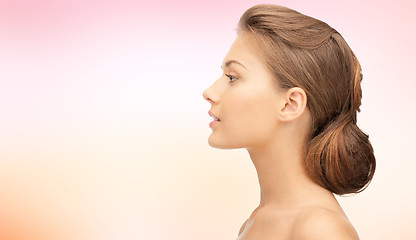 Image showing beautiful young woman face over blue background