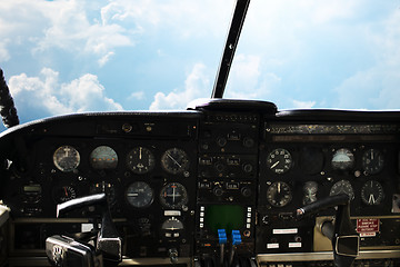 Image showing dashboard in airplane cockpit and view of sky