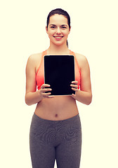 Image showing sporty woman with tablet pc blank screen