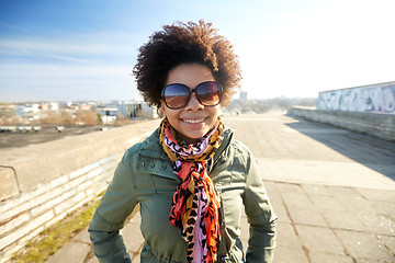 Image showing happy african american woman in shades on street
